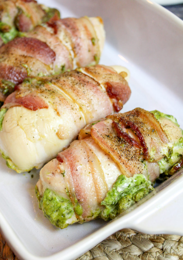 chicken breasts wrapped in bacon in a baking dish
