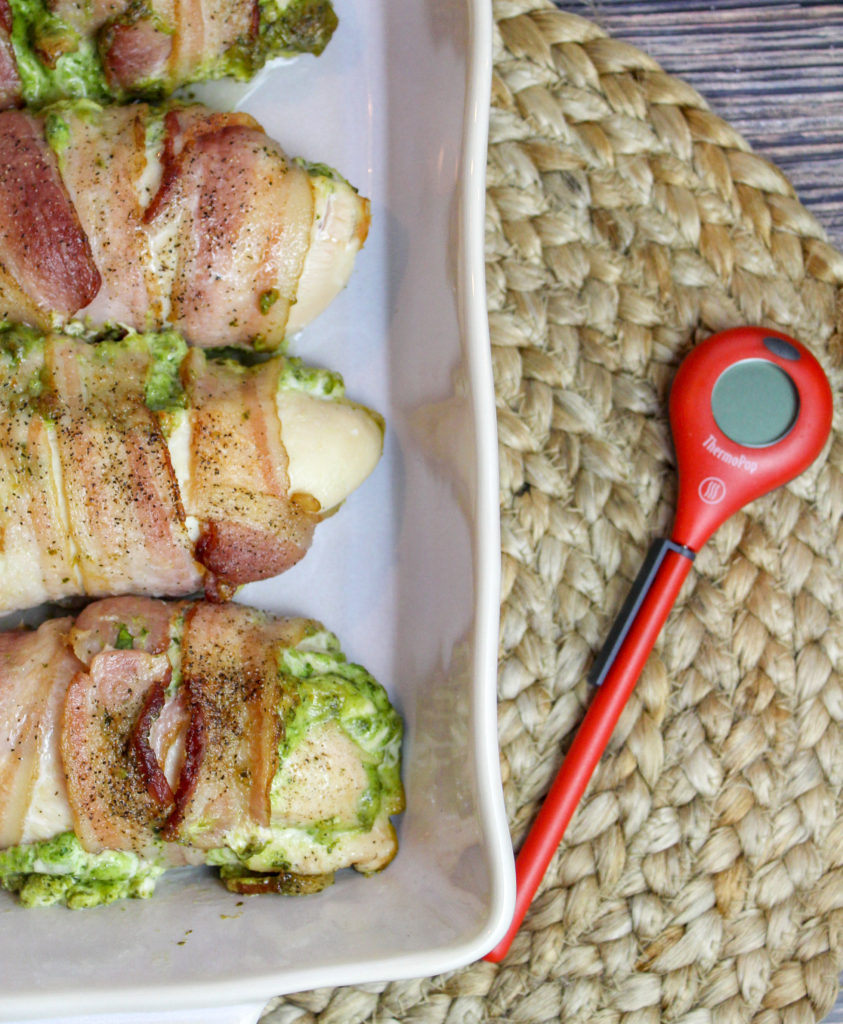 chicken breasts wrapped in bacon in a baking dish