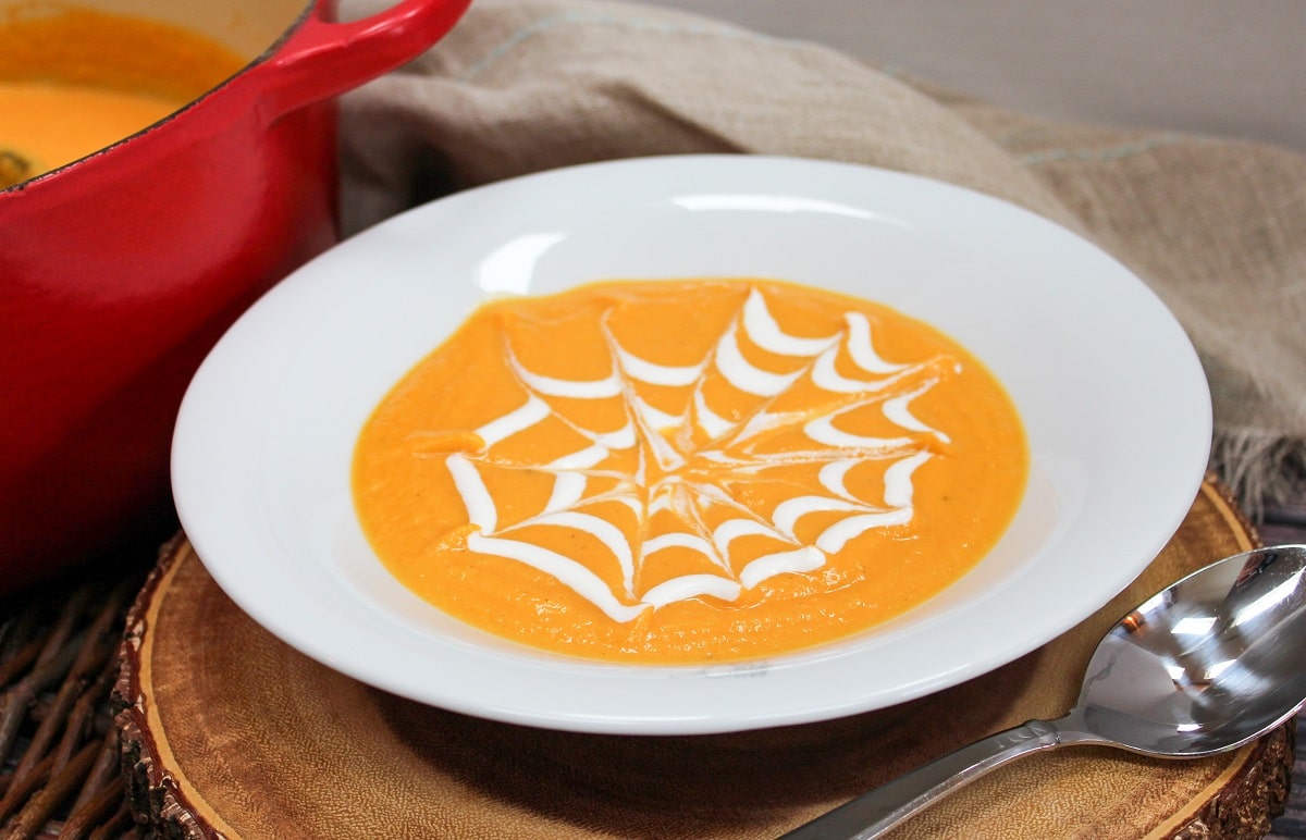 soup in a bowl with cream garnish