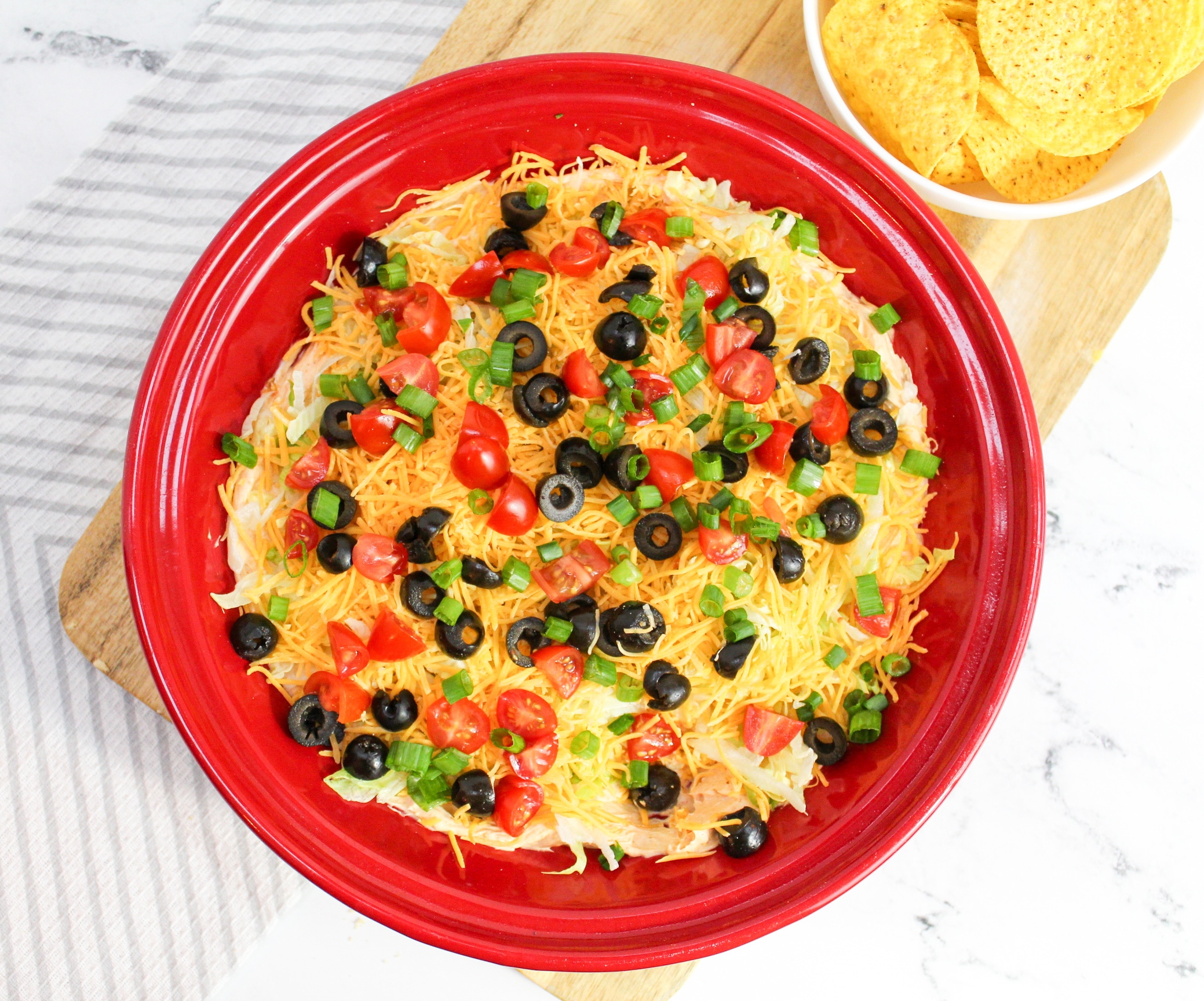 taco dip overhead shot in red plate