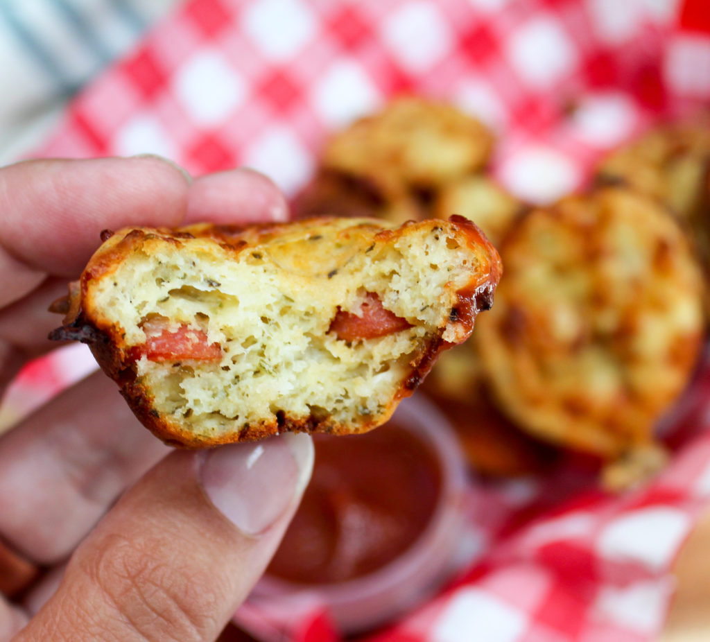 Pizza muffin with a bite taken from it