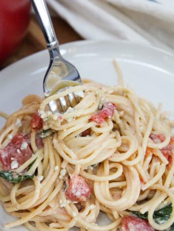blue cheese and tomato pasta with fork