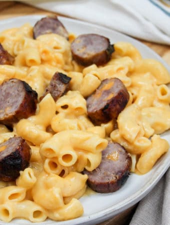 pasta and brats on a plate