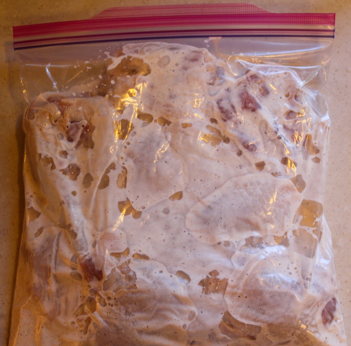 chicken in bag with buttermilk marinate