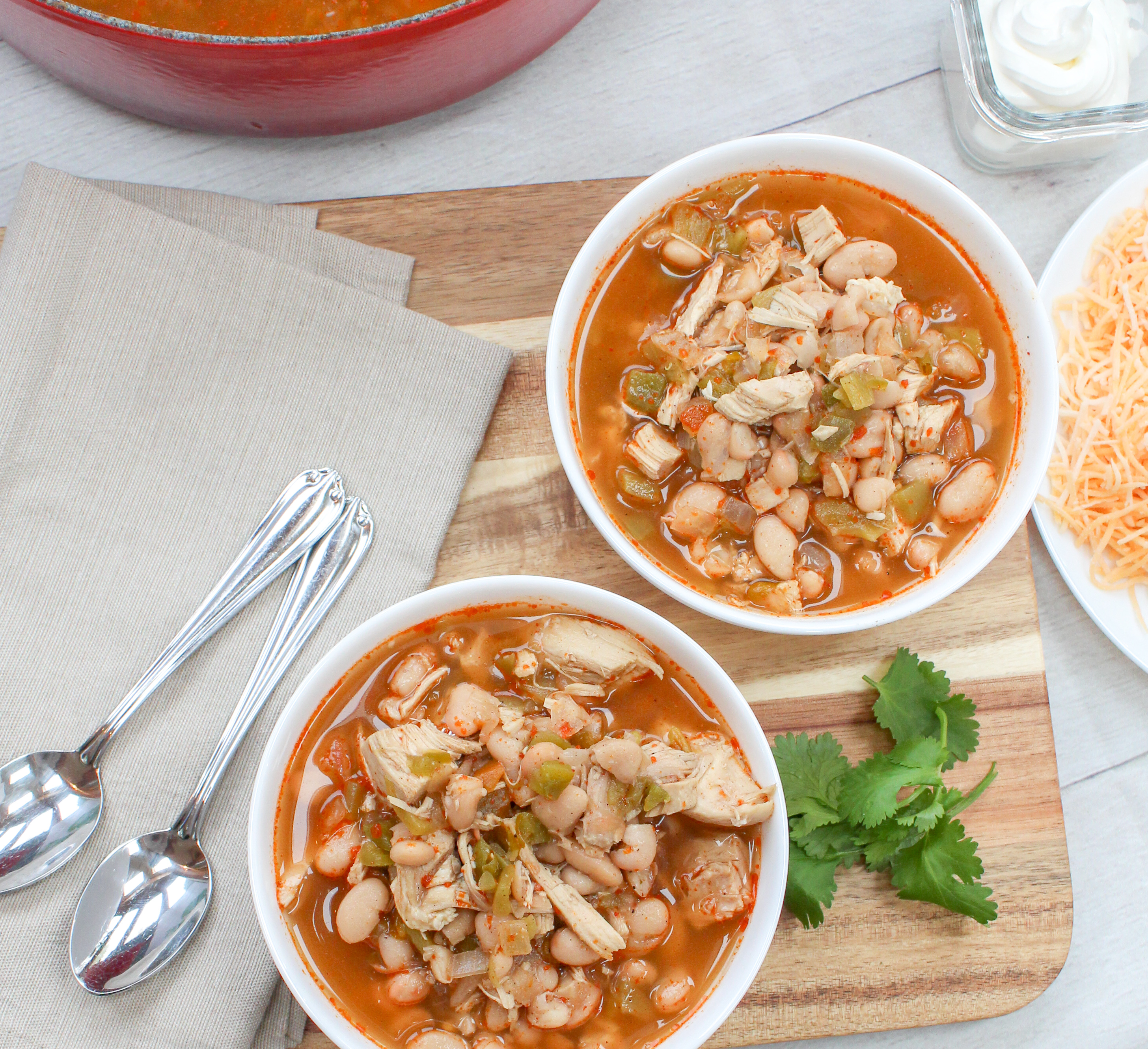 chicken, beans, and pepper soup in a white bowl