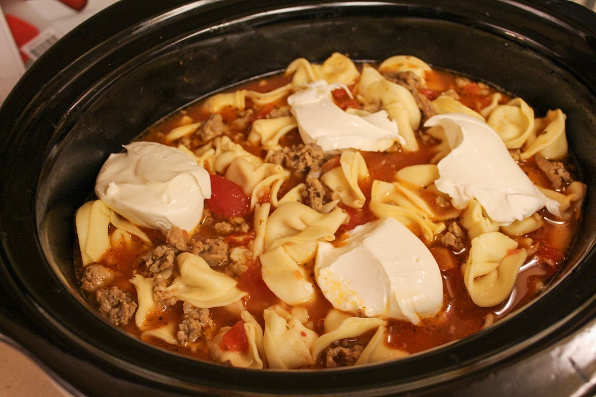cooked soup in slow cooker with cream cheese