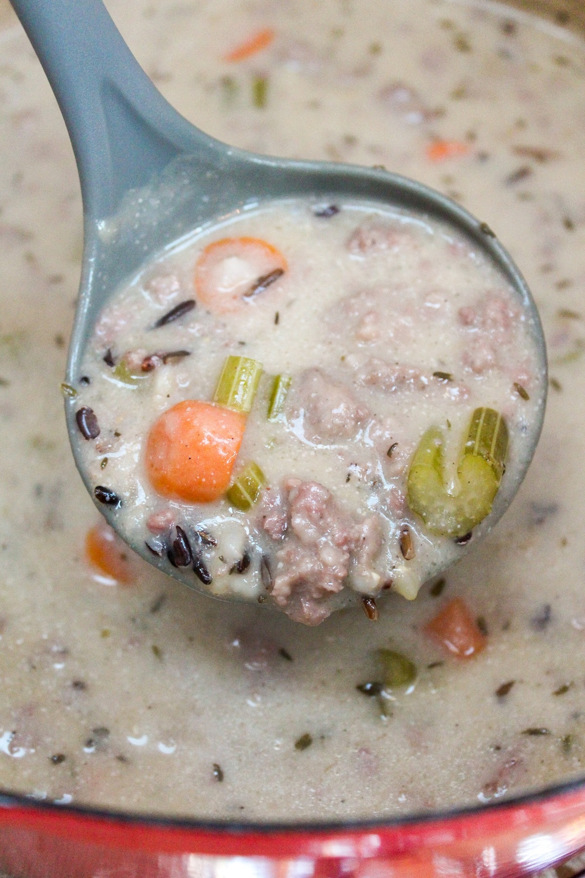 Creamy Wild Rice and Sausage Soup in a ladle
