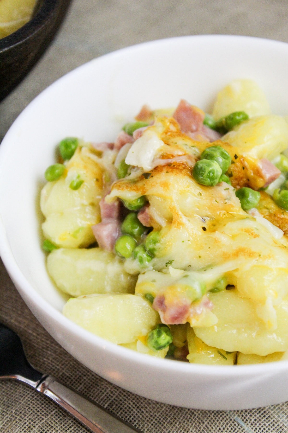 prep photos for ham and cheese gnocchi skillet scooped in a bowl