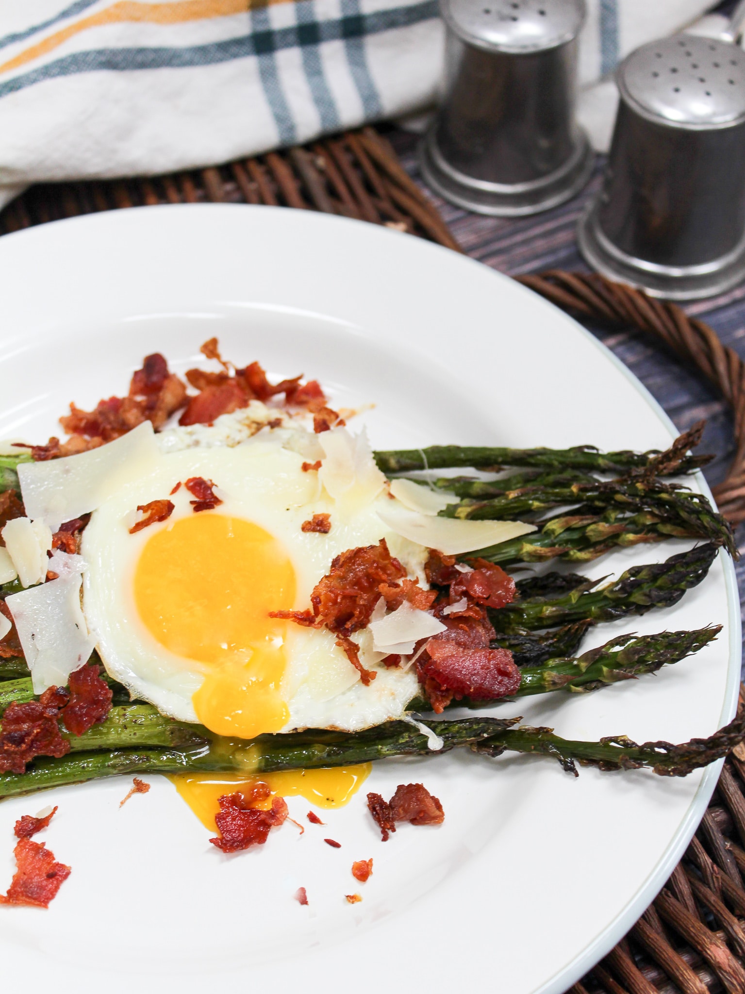 overhead shot of egg and asparagus salad on a plate
