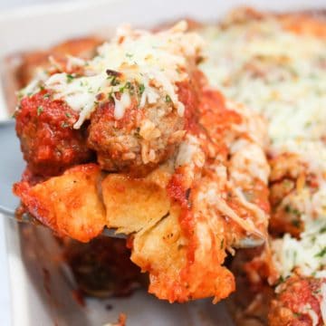 meatball sub casserole scooped from a pan