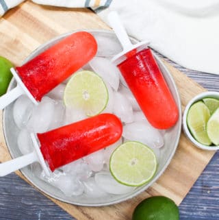 Popsicle over ice with limes