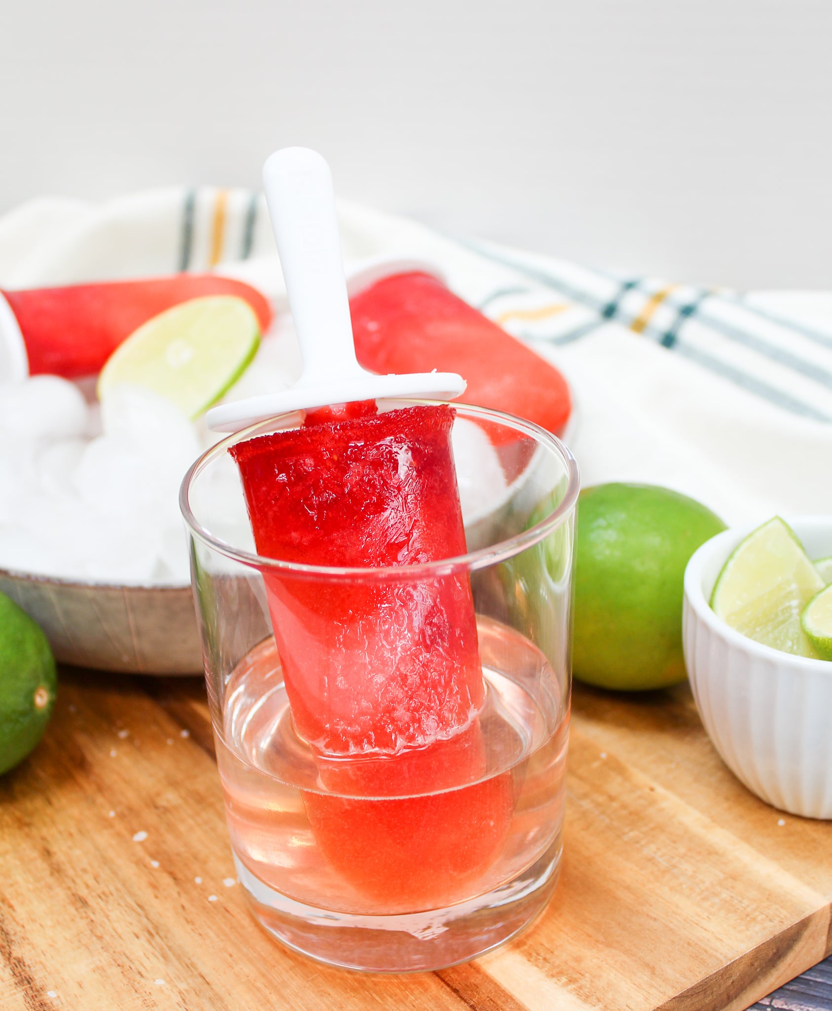 Popsicle upside down in a small glass to tequila and sprinkled with course salt