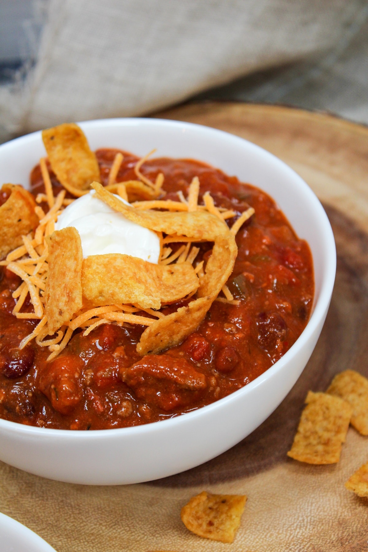 chili in a bowl with corn chips
