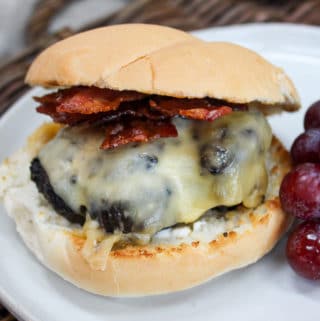 burger on a plate with grapes