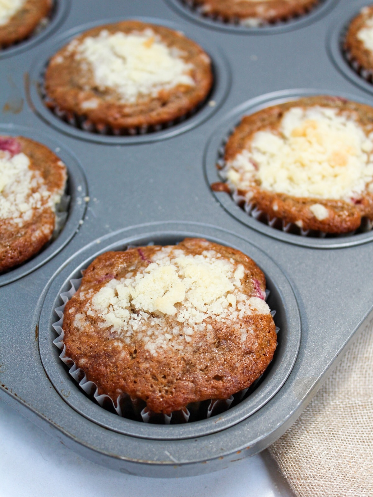 tart cherry crumb muffins in baking pan