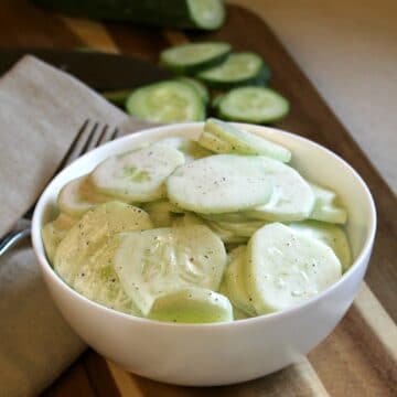 creamy cucumbers in a white bowl