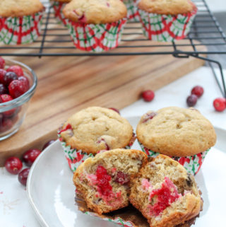Several Muffins on a plate and on cooling wrack