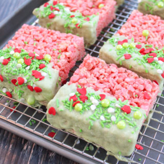 rice krispie treat squares dipped in white chocolate and sprinkles