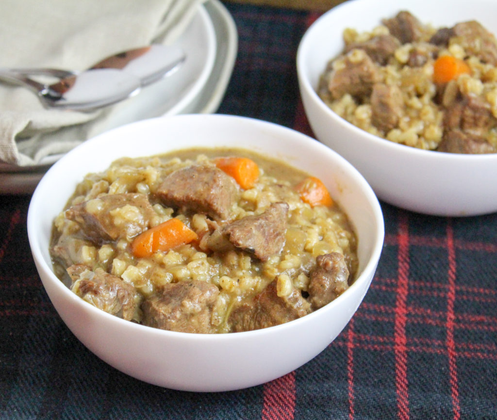 White bowls filled with beef ad barley stew