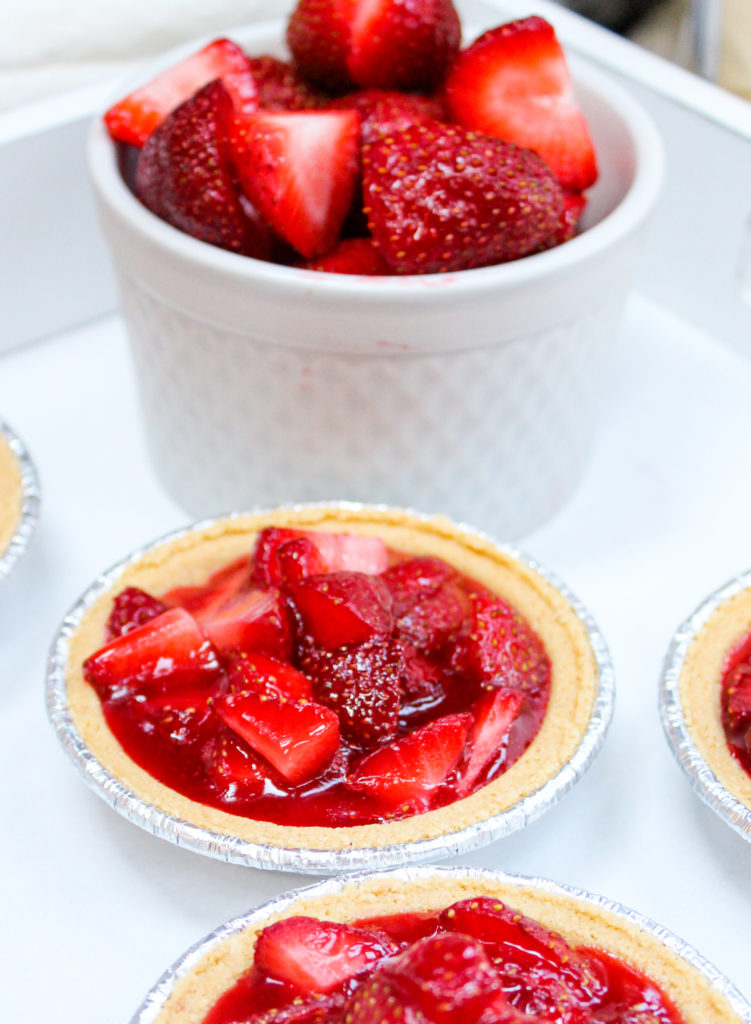 mini strawberry pies on a platter