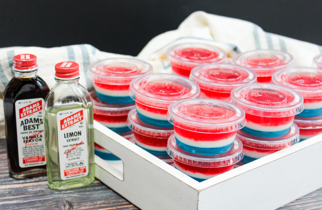 red white and blue jello shots in plastic containers
