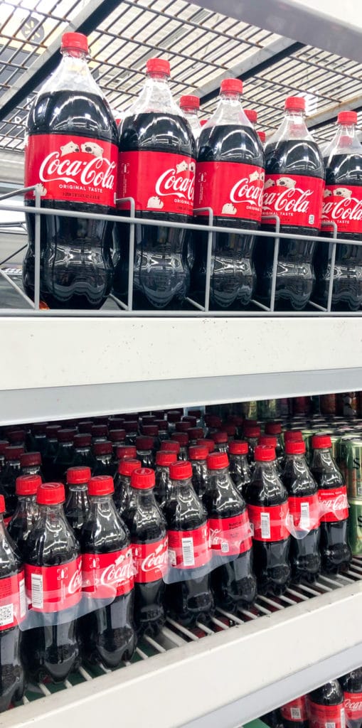 coca cola on selves at a store