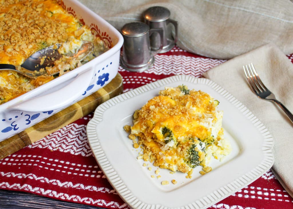 casserole on a plate with serving dish in background