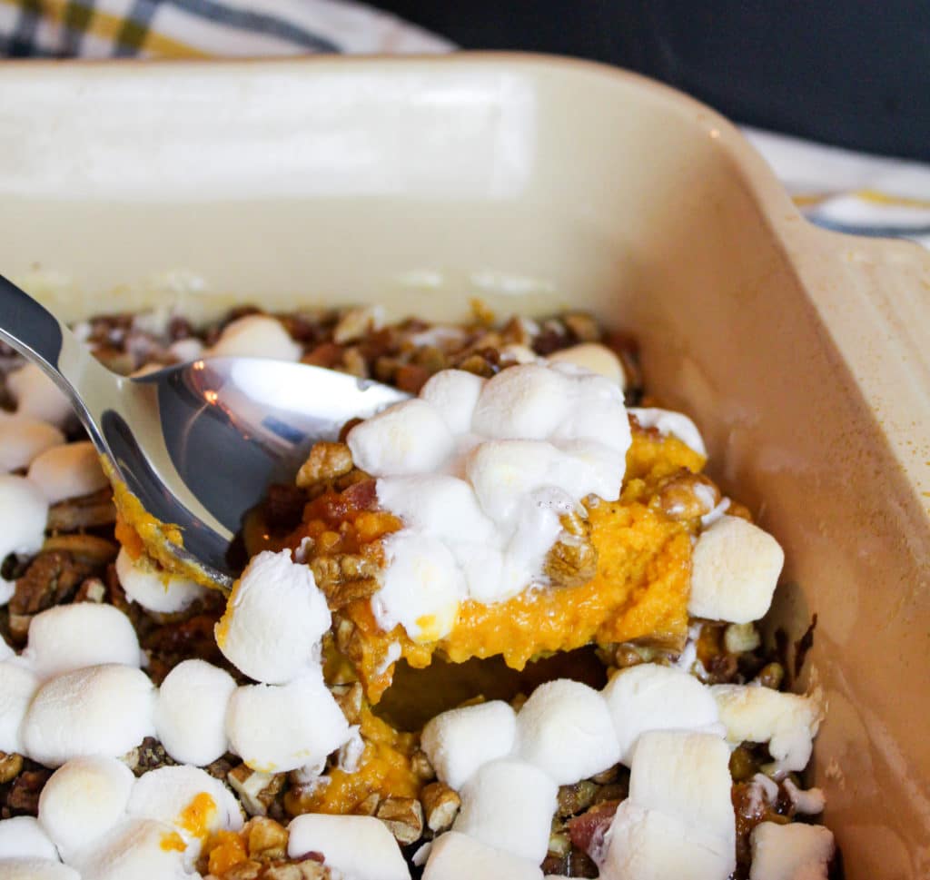 sweet potato casserole scooped from a baking dish