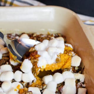 sweet potato casserole scooped from a baking dish