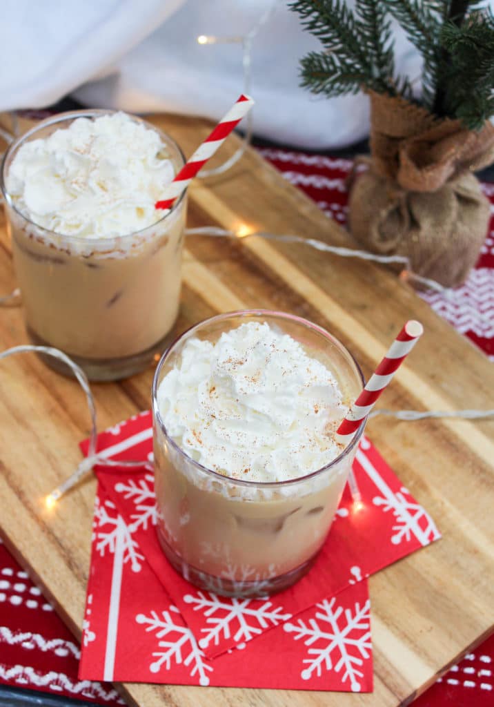Eggnog white Russian in a glass with whipped cream