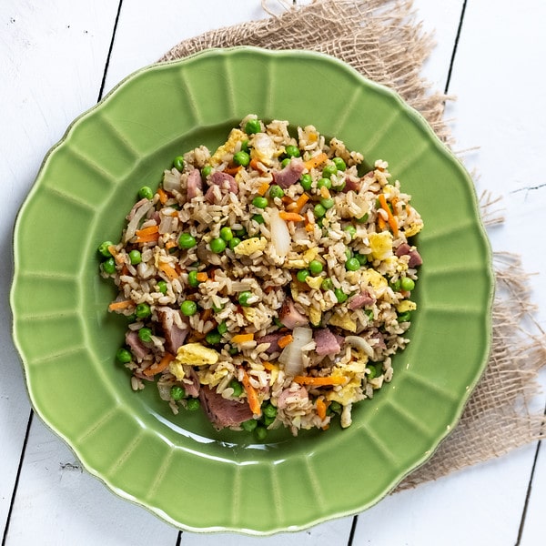 fried rice with ham on a plate