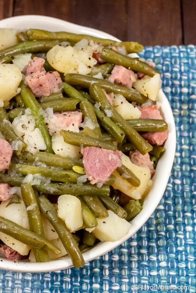 ham potatoes and green beans on a plate
