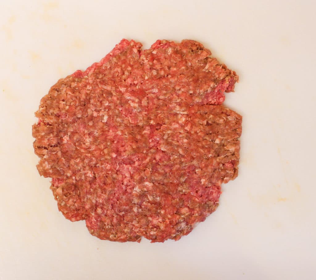 formed burger on prep surface