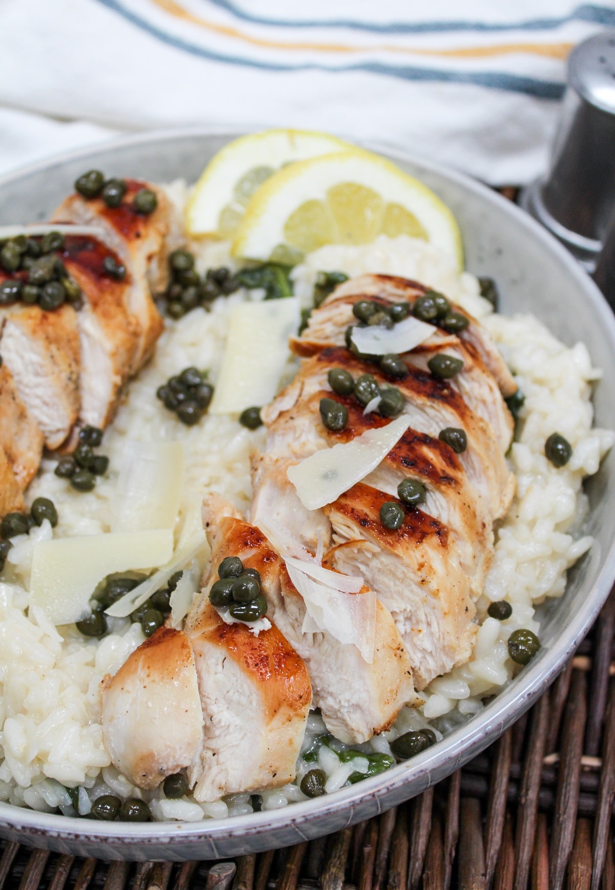 sliced chicken over risotto