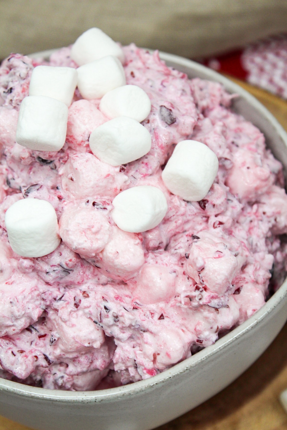 close-up of cranberry fluff salad with marshmallows on top