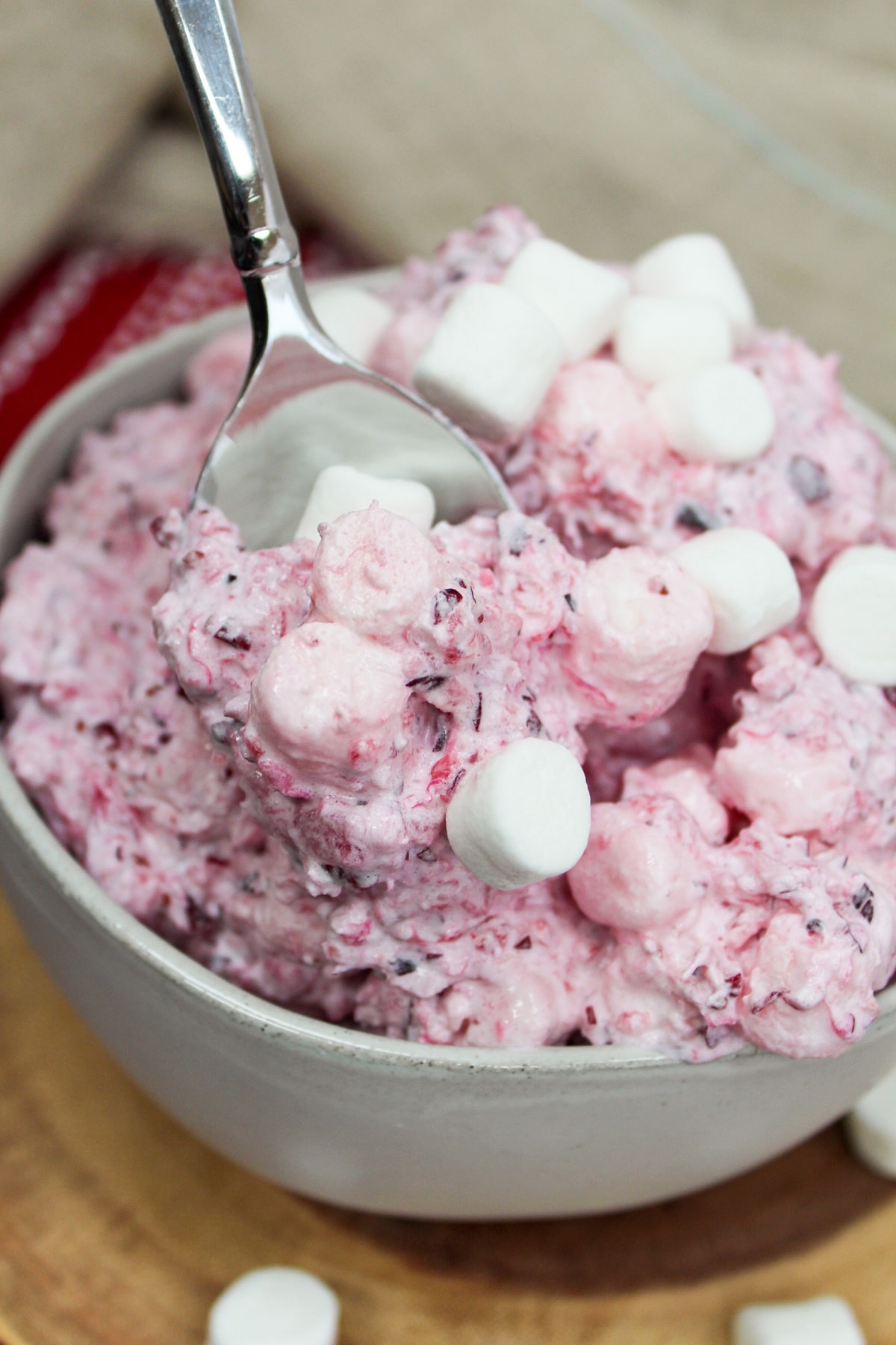 cranberry fluff salad on a spoon