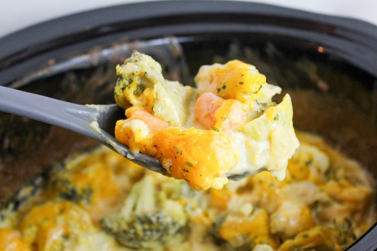 cheesy vegetables on a serving spoon