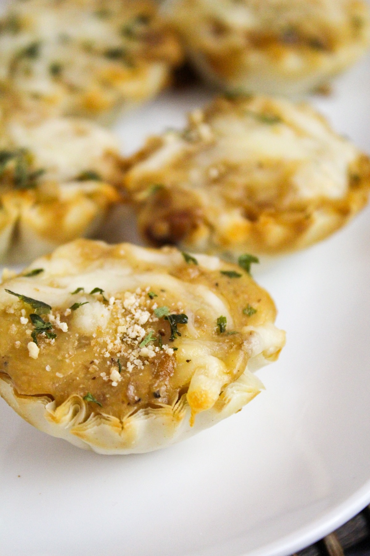 french onion tartletes on a plate