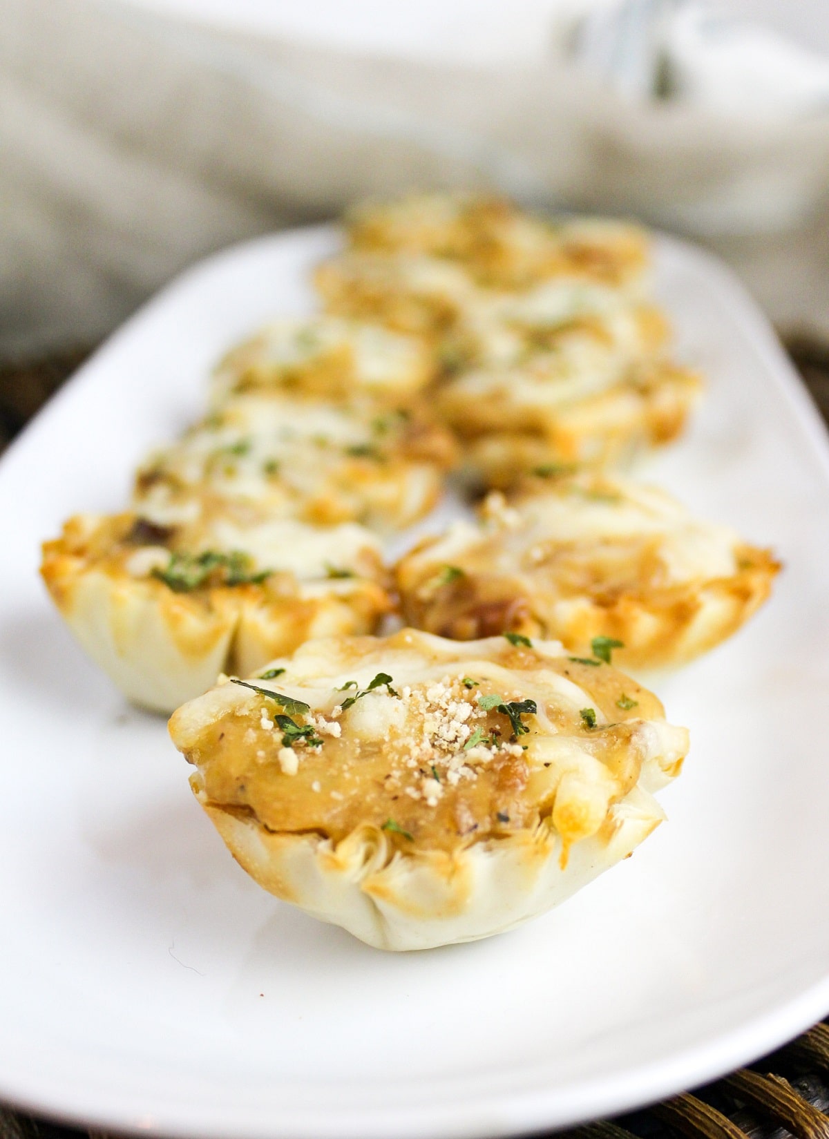french onion tartletes on a plate