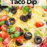taco dip with topping in a red plate