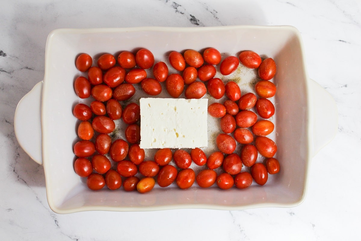 tomatoes and block of feta in dish