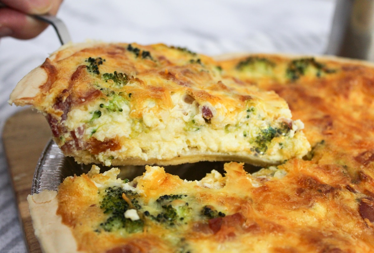 bacon broccoli quiche lifted from a pan