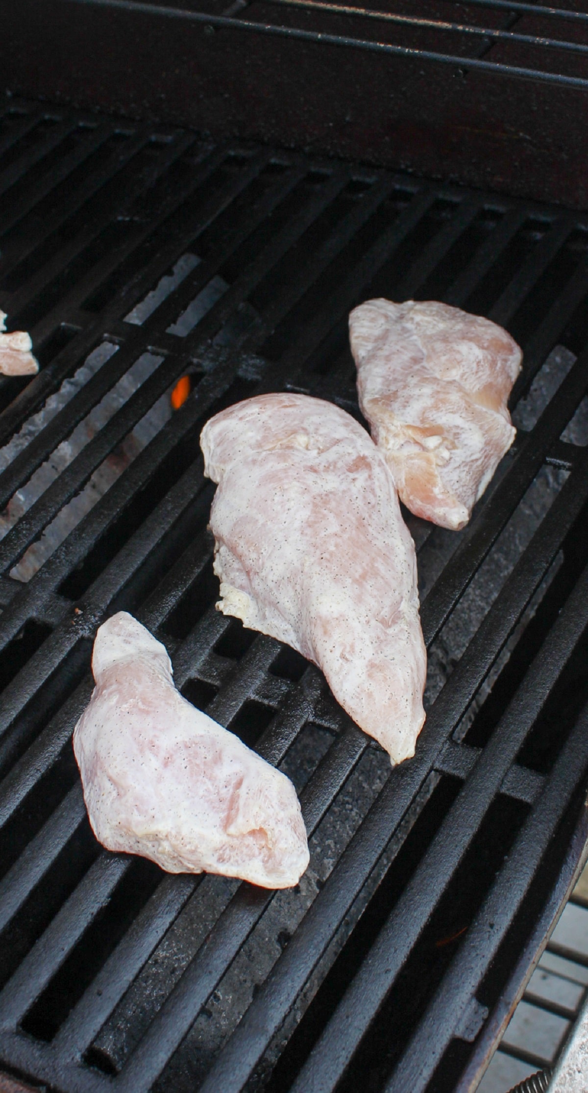 uncooked chicken on grill