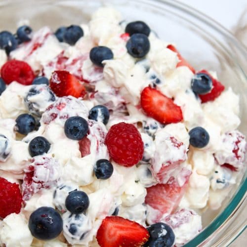 red white and blue cheesecake salad in a bowl