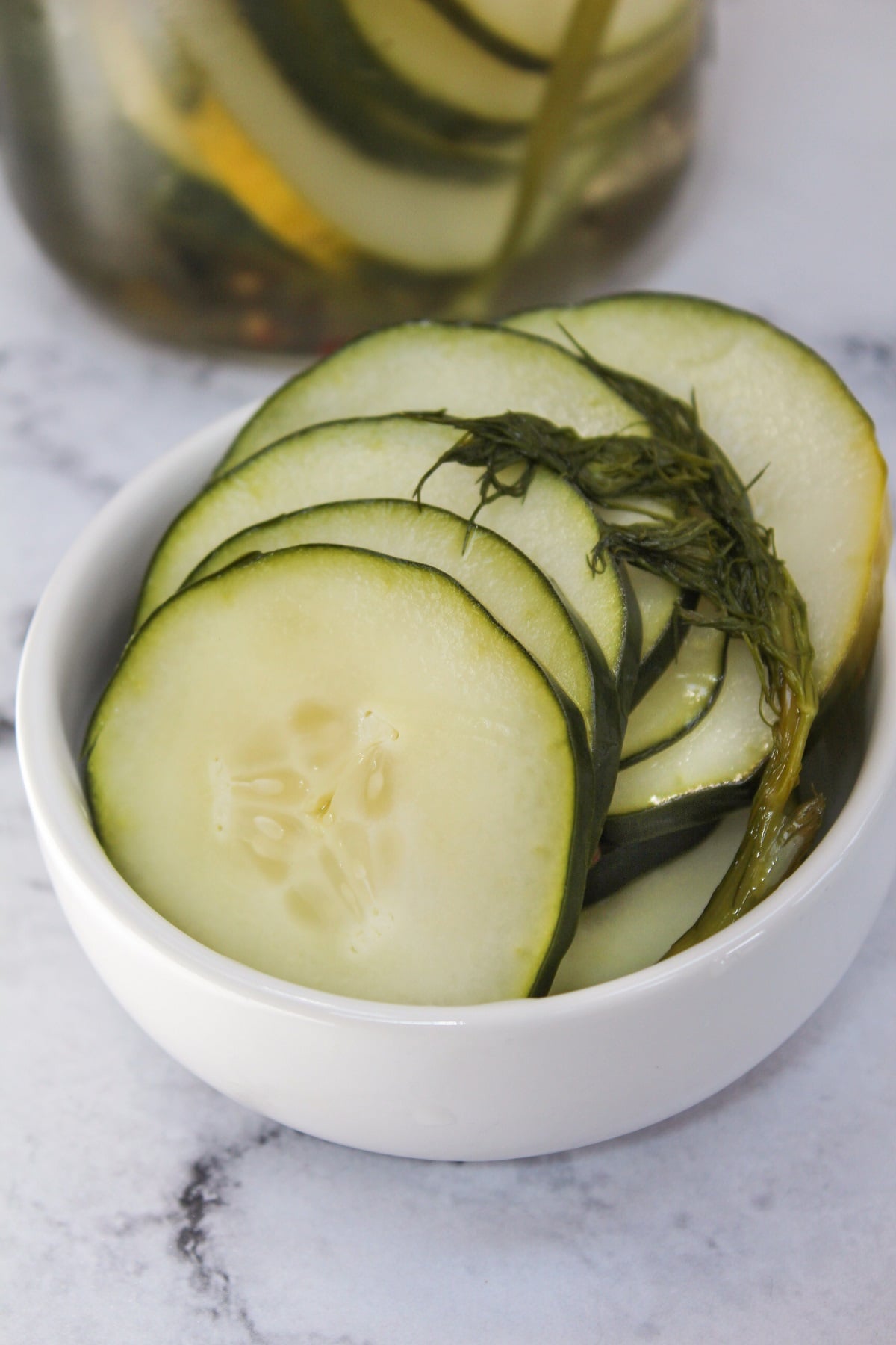 easy refrigerator dill pickles in a white dish