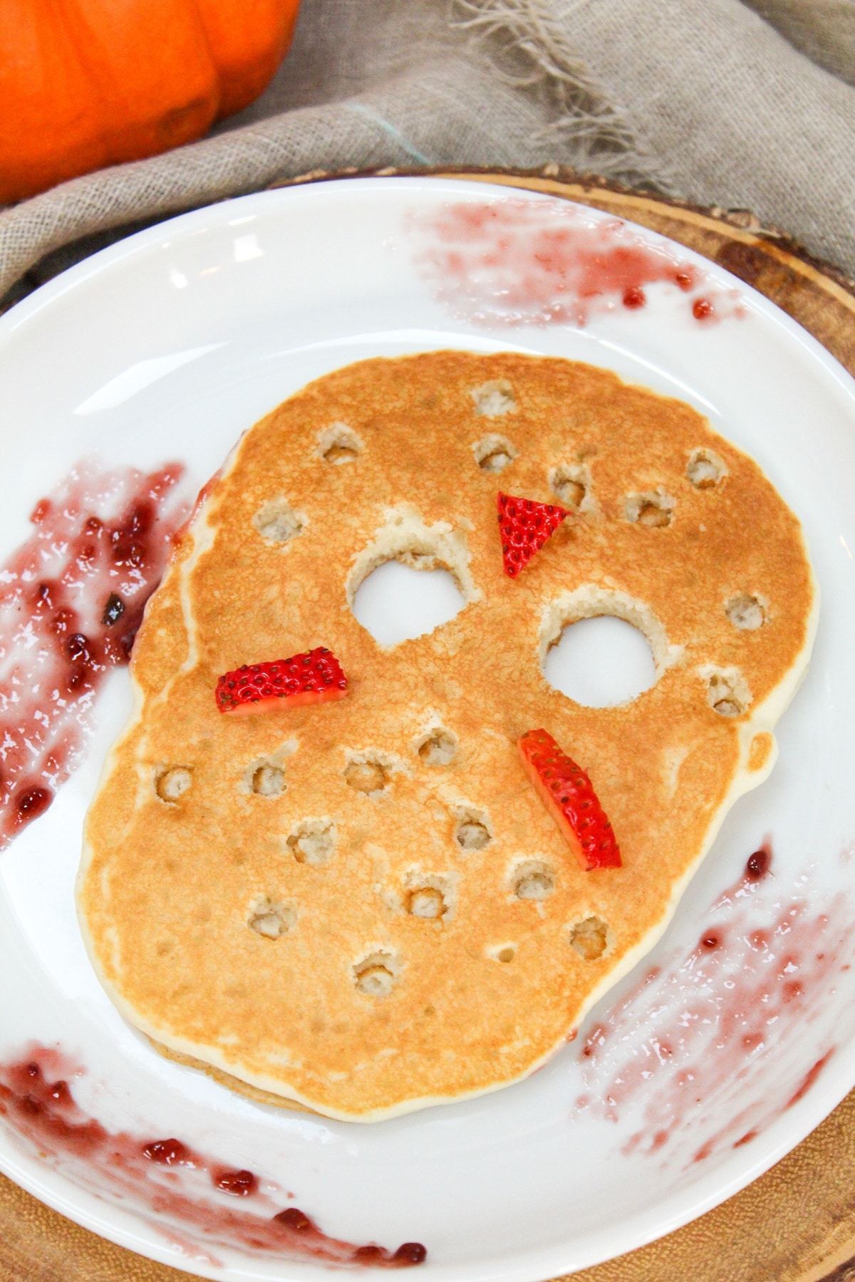 jason vorhees ski mask pancake on a plate with raspberry jam on the plate