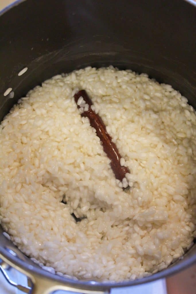 cooked rice with a cinnamon stick