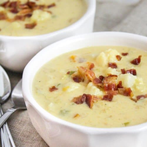cheesy cauliflower soup in a white bowl
