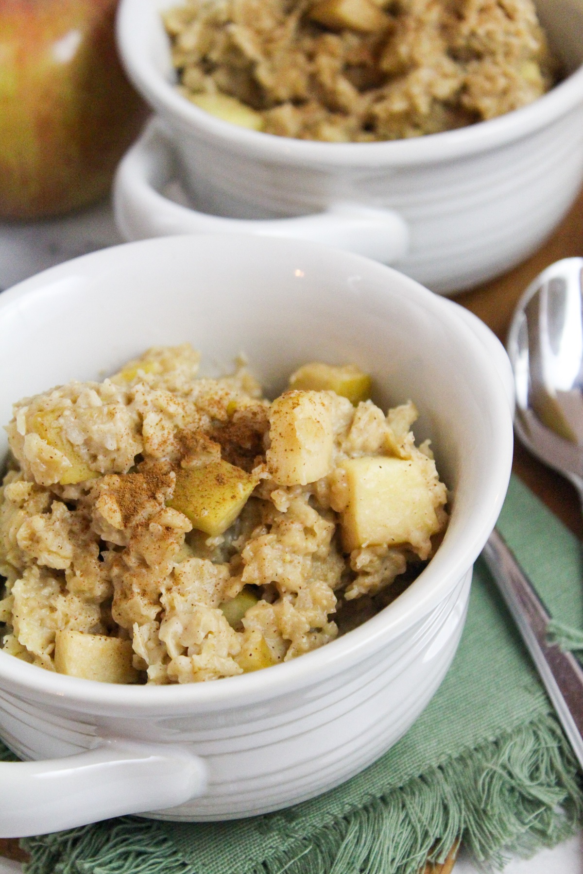 slow cooker apple cinnamon oatmeal in a white bowl