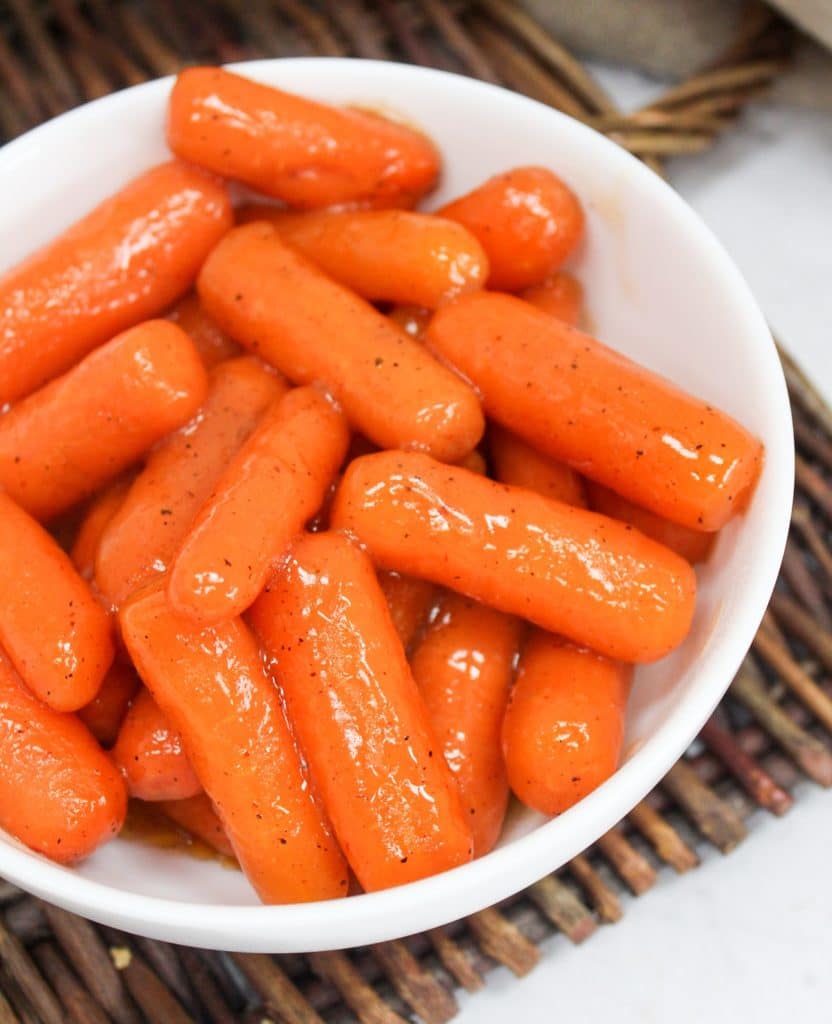 slow cooker brown sugar carrots in a white bowl